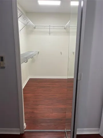 a bathroom with a shower and a mirror