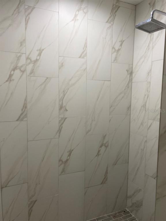 12 Prairie Lane Palm Coast, FL 32164 - Photo 23 of 41 a bathroom with a shower