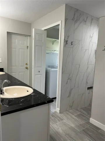 a view of a closet area with an empty room