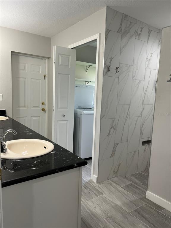 12 Prairie Lane Palm Coast, FL 32164 - Photo 26 of 41 a bathroom with a granite countertop sink a toilet and shower