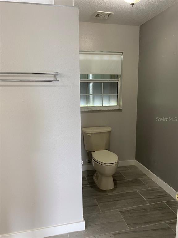 12 Prairie Lane Palm Coast, FL 32164 - Photo 28 of 41 a bathroom with a toilet and a sink