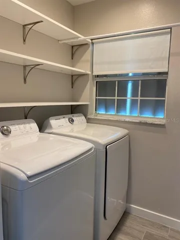 a utility room with dryer and washer