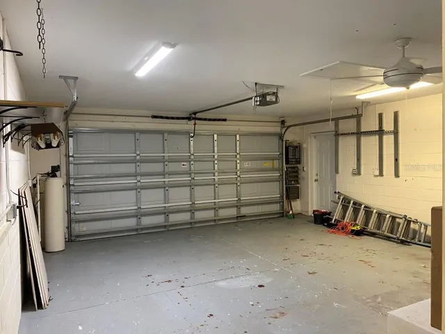 a view of backyard with swimming pool