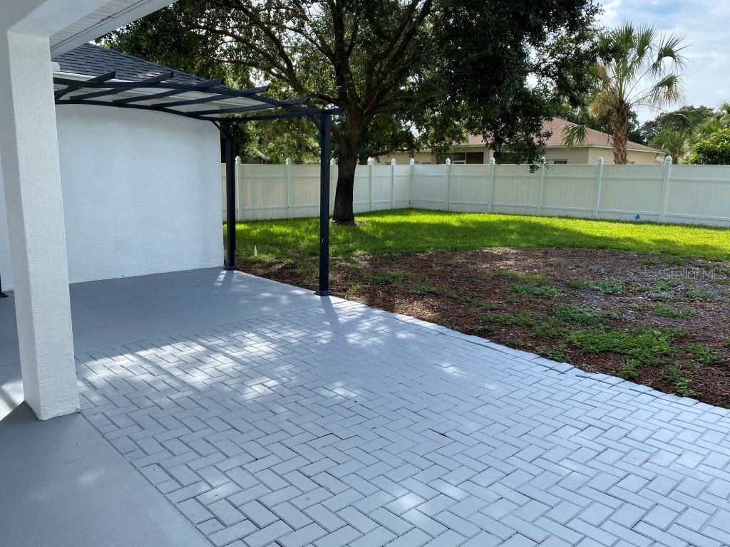 12 Prairie Lane Palm Coast, FL 32164 - Photo 33 of 41 a view of a yard with potted plants