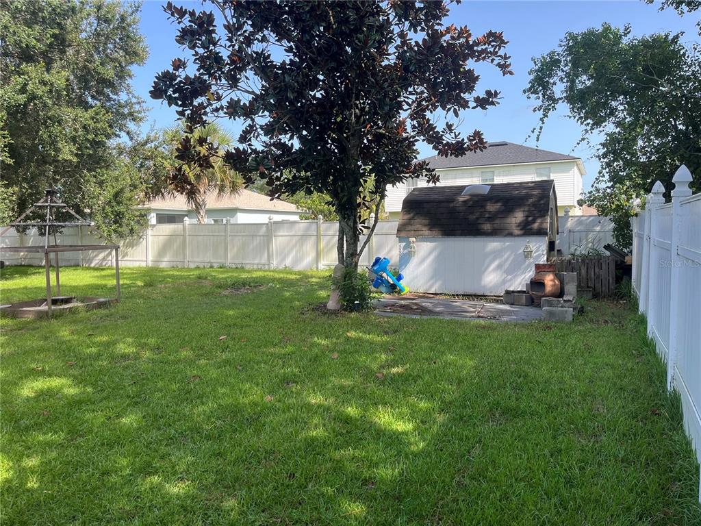 12 Prairie Lane Palm Coast, FL 32164 - Photo 40 of 41 a view of back yard with green space