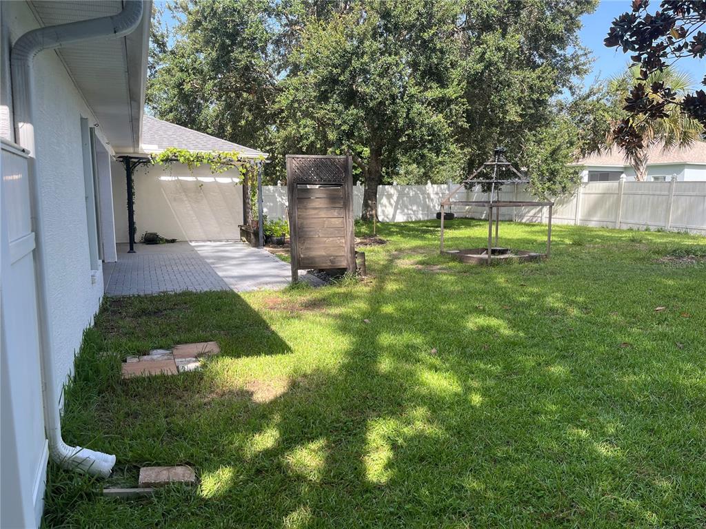 12 Prairie Lane Palm Coast, FL 32164 - Photo 41 of 41 a view of a back yard of the house along with trees
