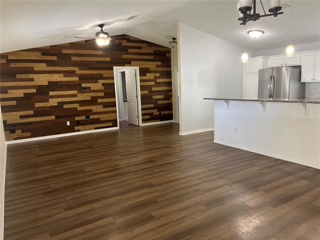 12 Prairie Lane Palm Coast, FL 32164 - Photo 6 of 41 a view of a room with wooden floor