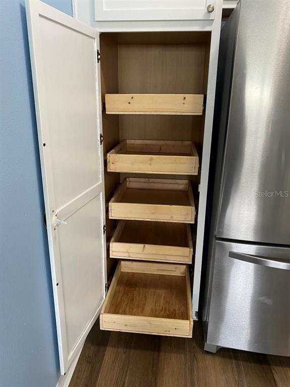 12 Prairie Lane Palm Coast, FL 32164 - Photo 8 of 41 a view of walk in closet with wooden floor