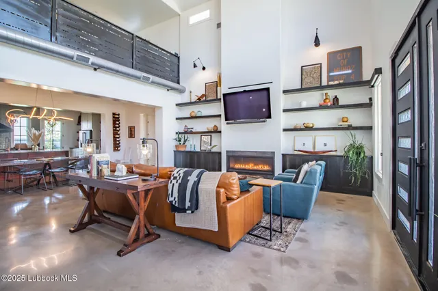 a living room with furniture or couch and a flat screen tv