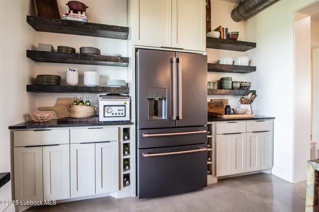 a spacious bedroom with a bed and a couch