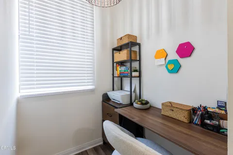 a bedroom with bed and a window