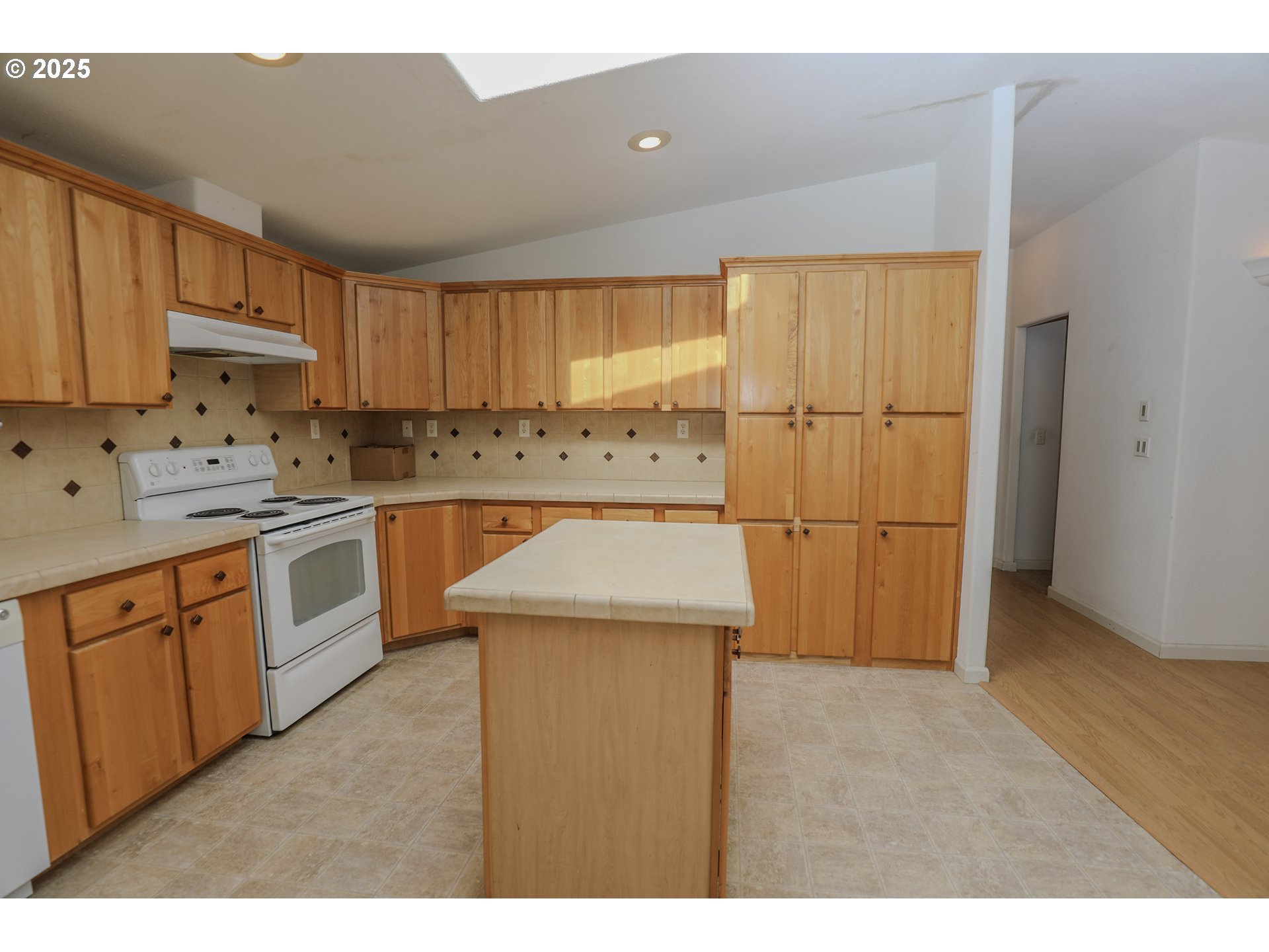 173 North Main Street Winston, OR 97496 - Photo 11 of 45 a kitchen that has a sink a stove and cabinets