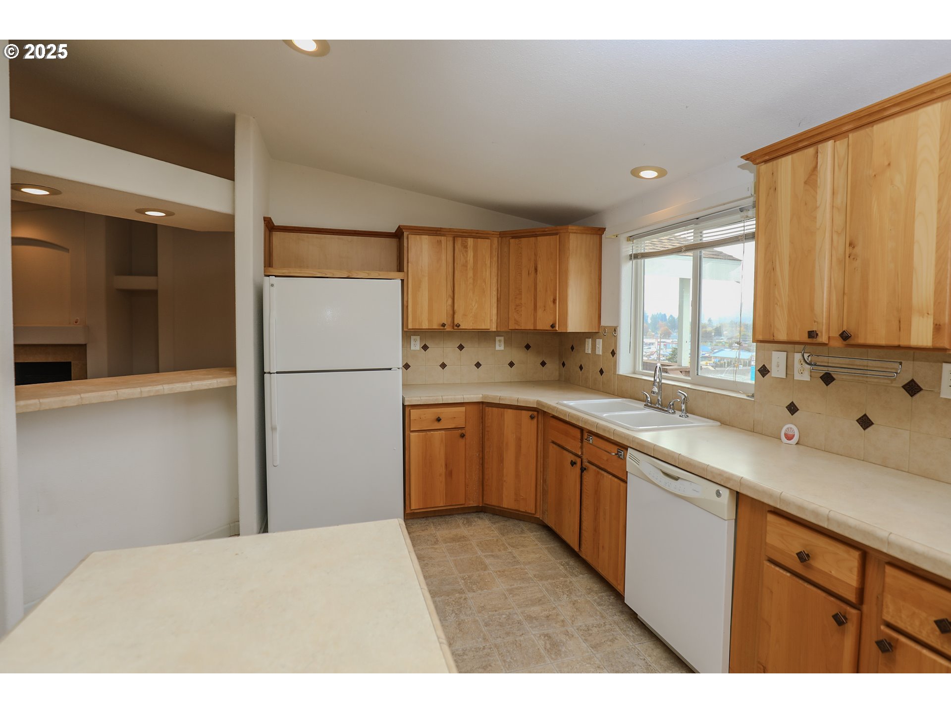 173 North Main Street Winston, OR 97496 - Photo 13 of 45 a kitchen with a refrigerator sink and cabinets