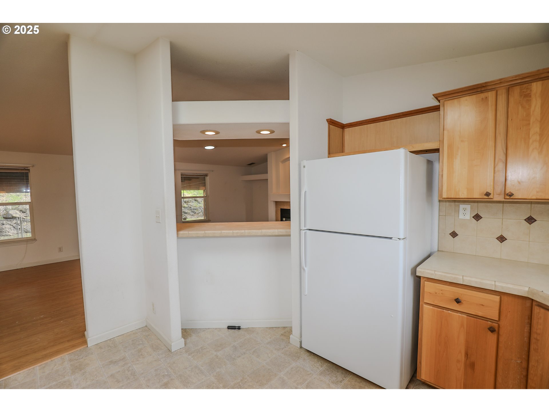 173 North Main Street Winston, OR 97496 - Photo 14 of 45 a white refrigerator freezer sitting in a kitchen
