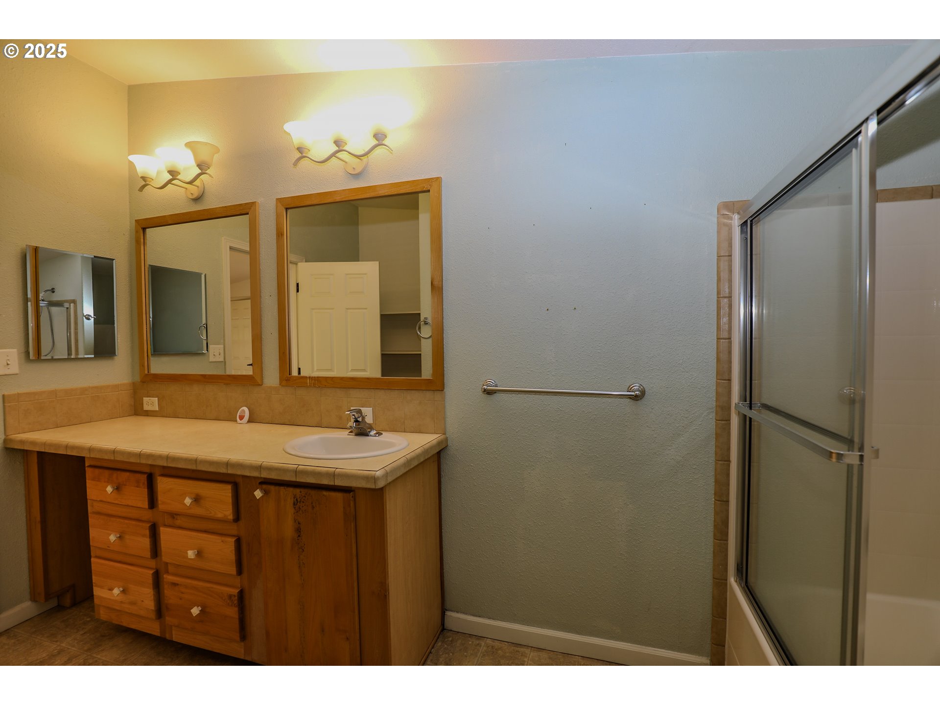 173 North Main Street Winston, OR 97496 - Photo 24 of 45 a bathroom with a sink and a mirror
