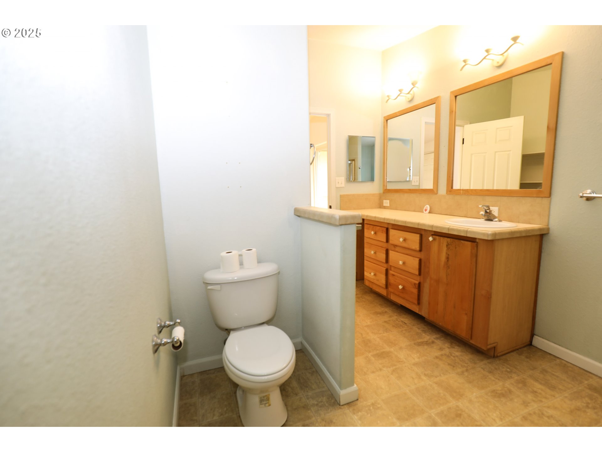 173 North Main Street Winston, OR 97496 - Photo 25 of 45 a bathroom with a toilet sink and mirror