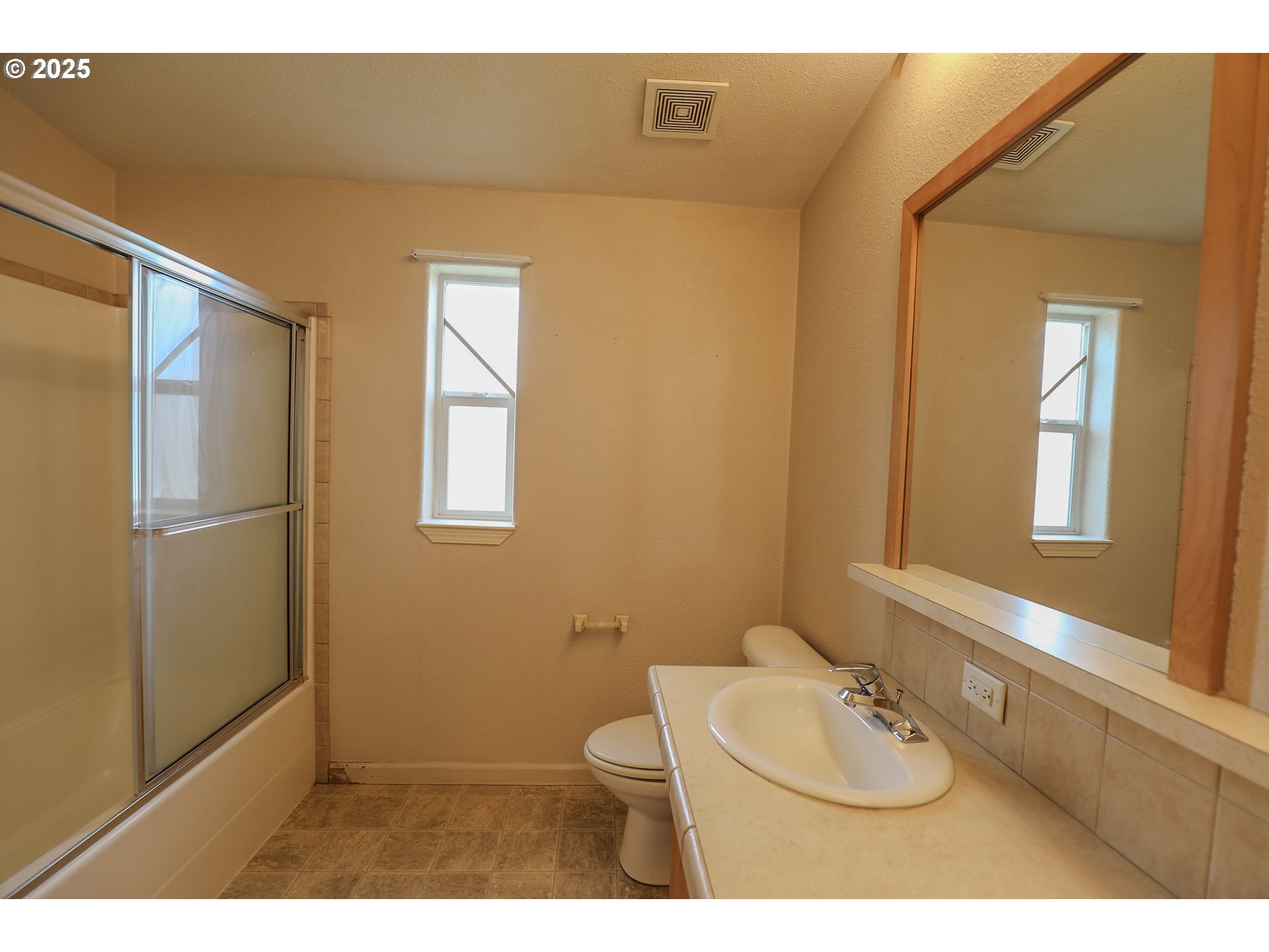 173 North Main Street Winston, OR 97496 - Photo 30 of 45 a bathroom with a sink toilet and mirror