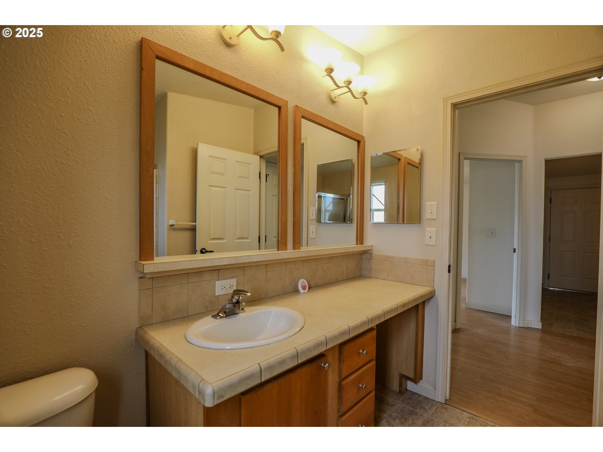 173 North Main Street Winston, OR 97496 - Photo 31 of 45 a bathroom with a sink and a mirror