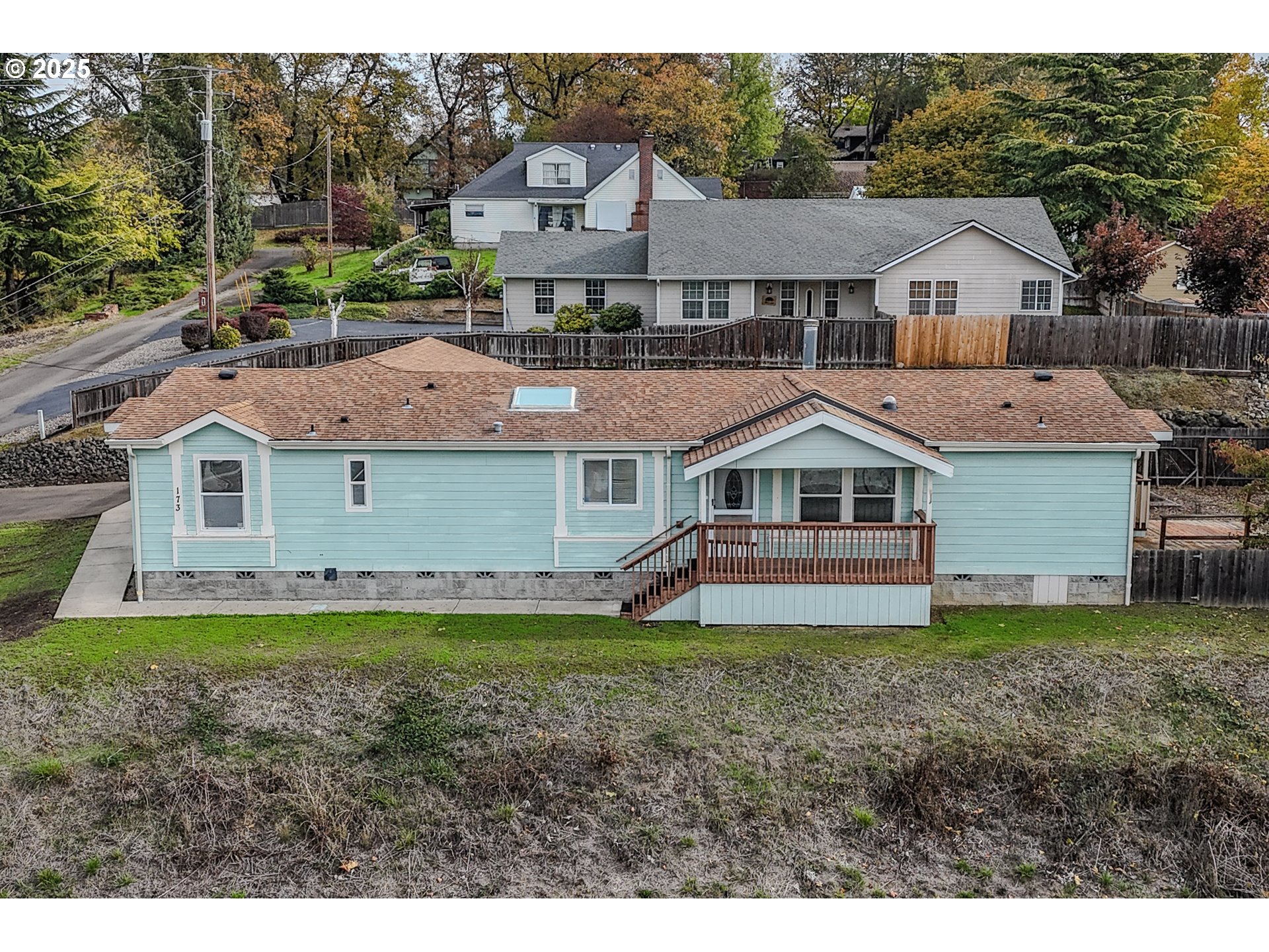 173 North Main Street Winston, OR 97496 - Photo 45 of 45 a aerial view of a house next to a big yard and large trees