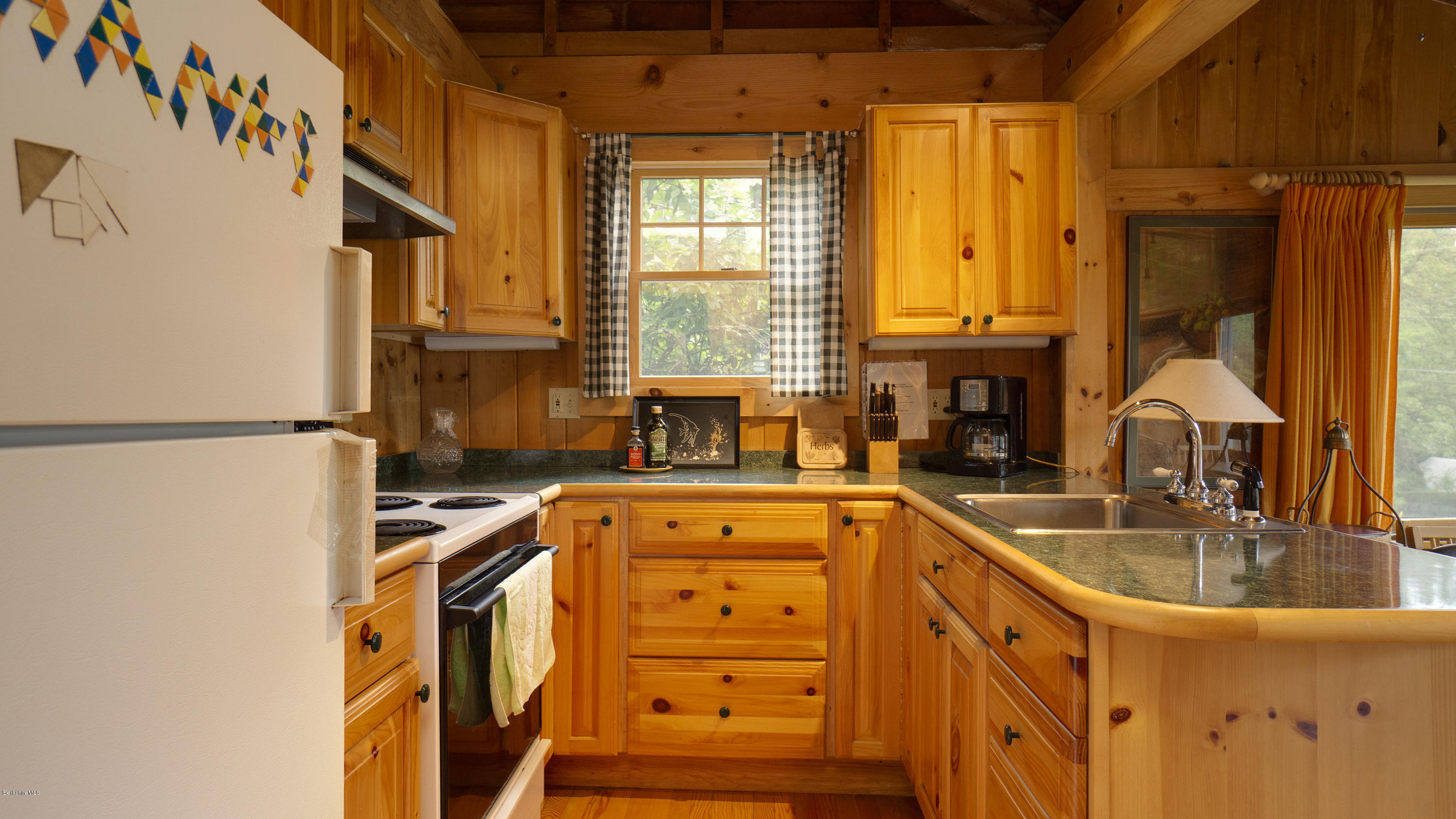 18 Mahkeenac Heights Road Stockbridge, MA 01262 - Photo 11 of 19 a kitchen with stainless steel appliances granite countertop a sink a stove and a refrigerator