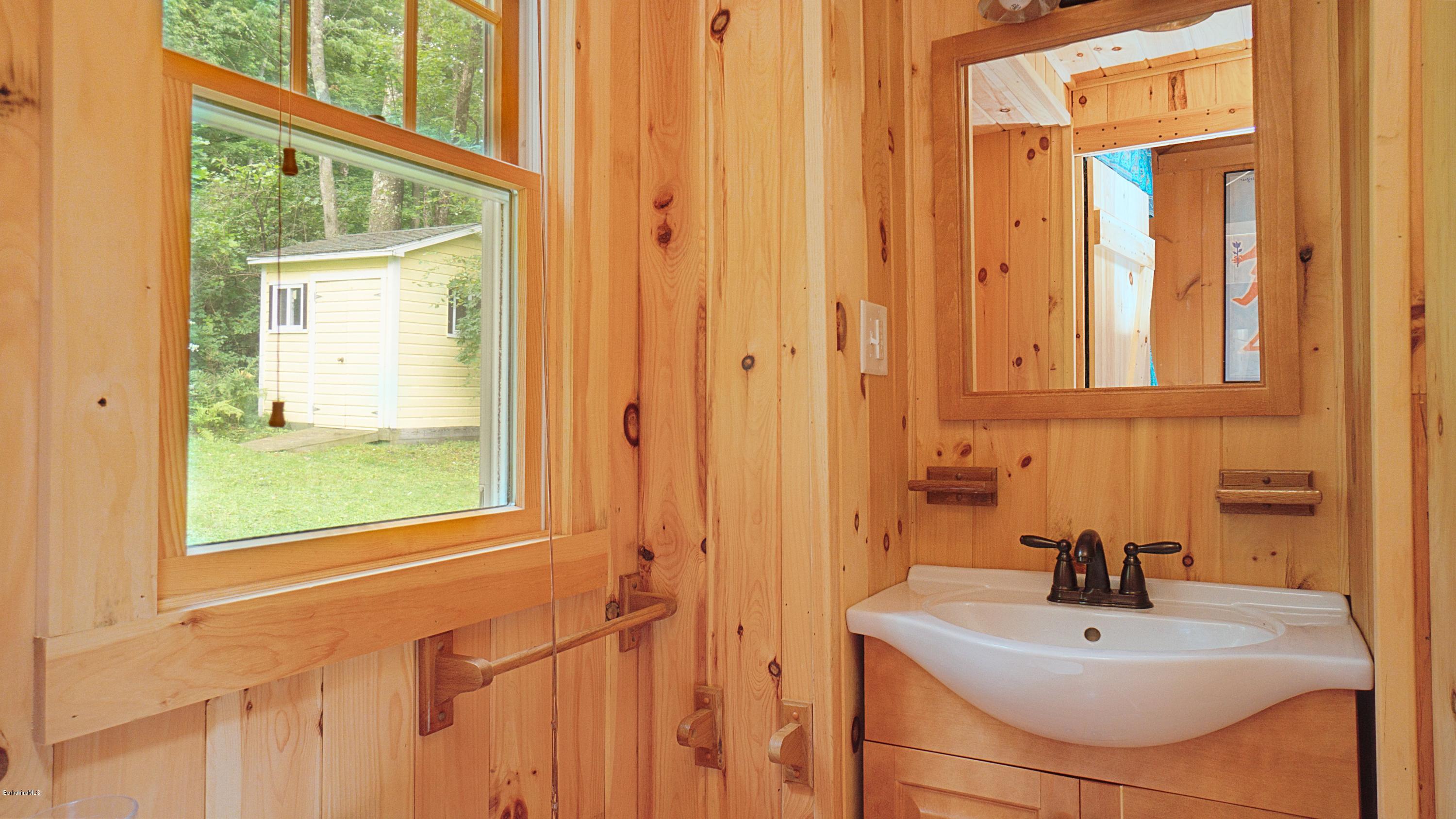 18 Mahkeenac Heights Road Stockbridge, MA 01262 - Photo 17 of 19 a bathroom with a sink a mirror and a window