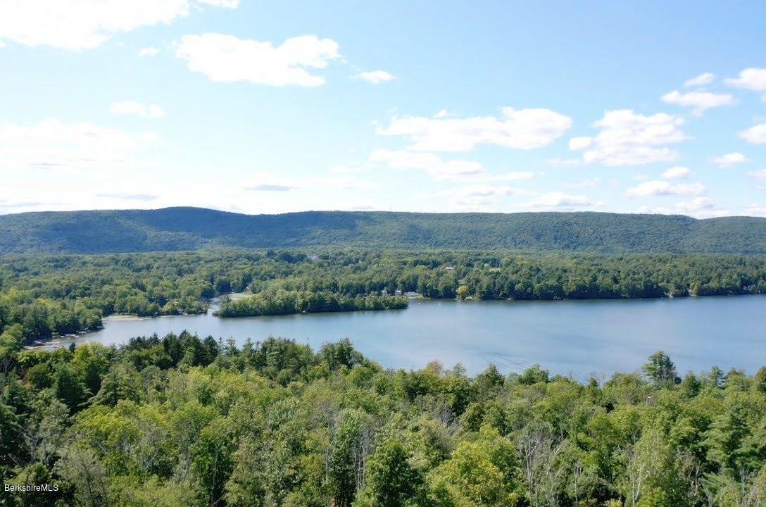 18 Mahkeenac Heights Road Stockbridge, MA 01262 - Photo 3 of 19 a view of a lake with houses in the back