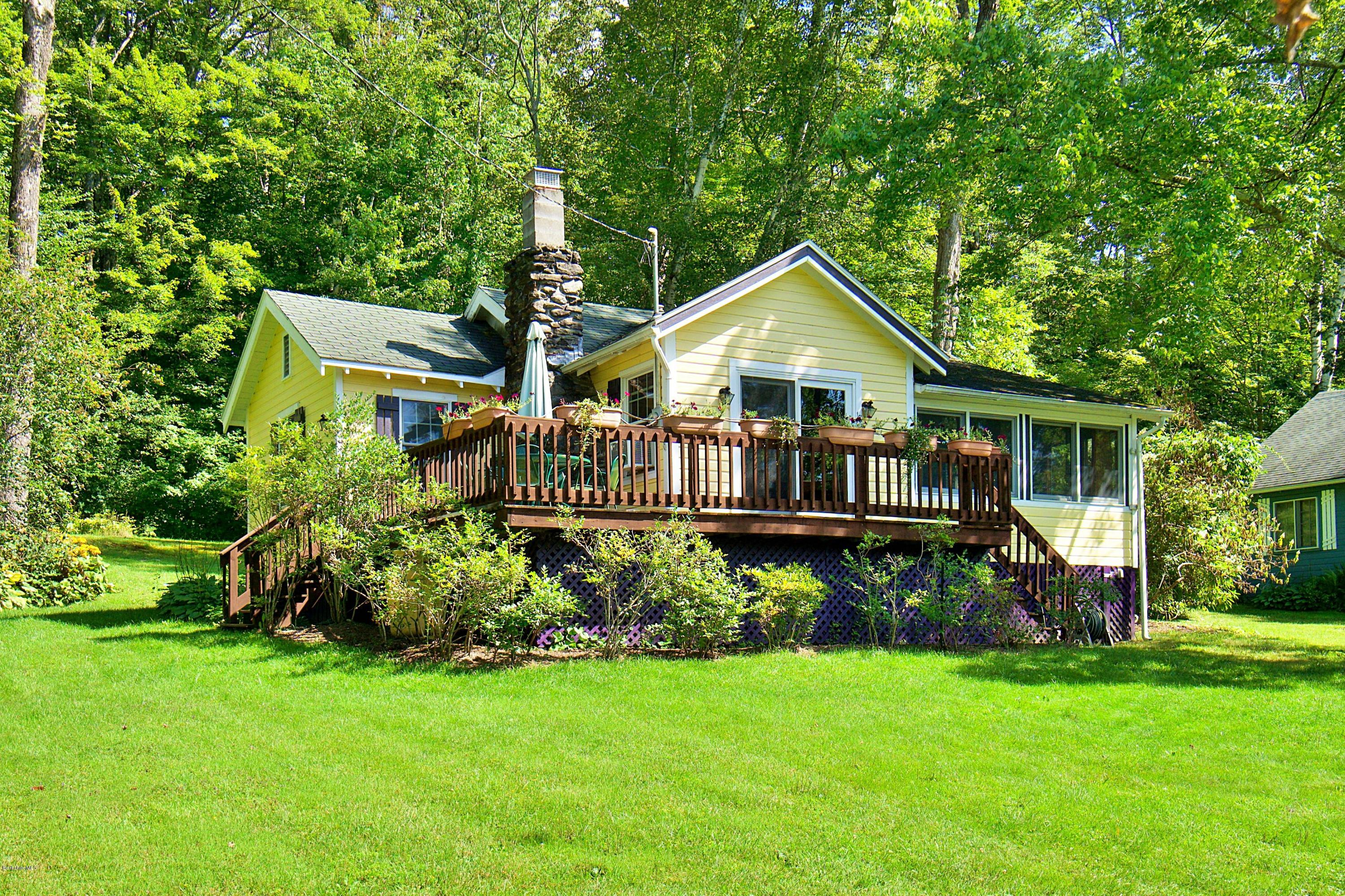 18 Mahkeenac Heights Road Stockbridge, MA 01262 - Photo 4 of 19 a view of a house with a yard and sitting area