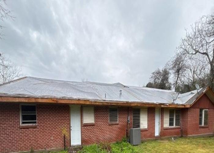 1301 Vauthier Street La Marque, TX 77568 - Photo 2 of 19 a view of a house with a sink and a yard
