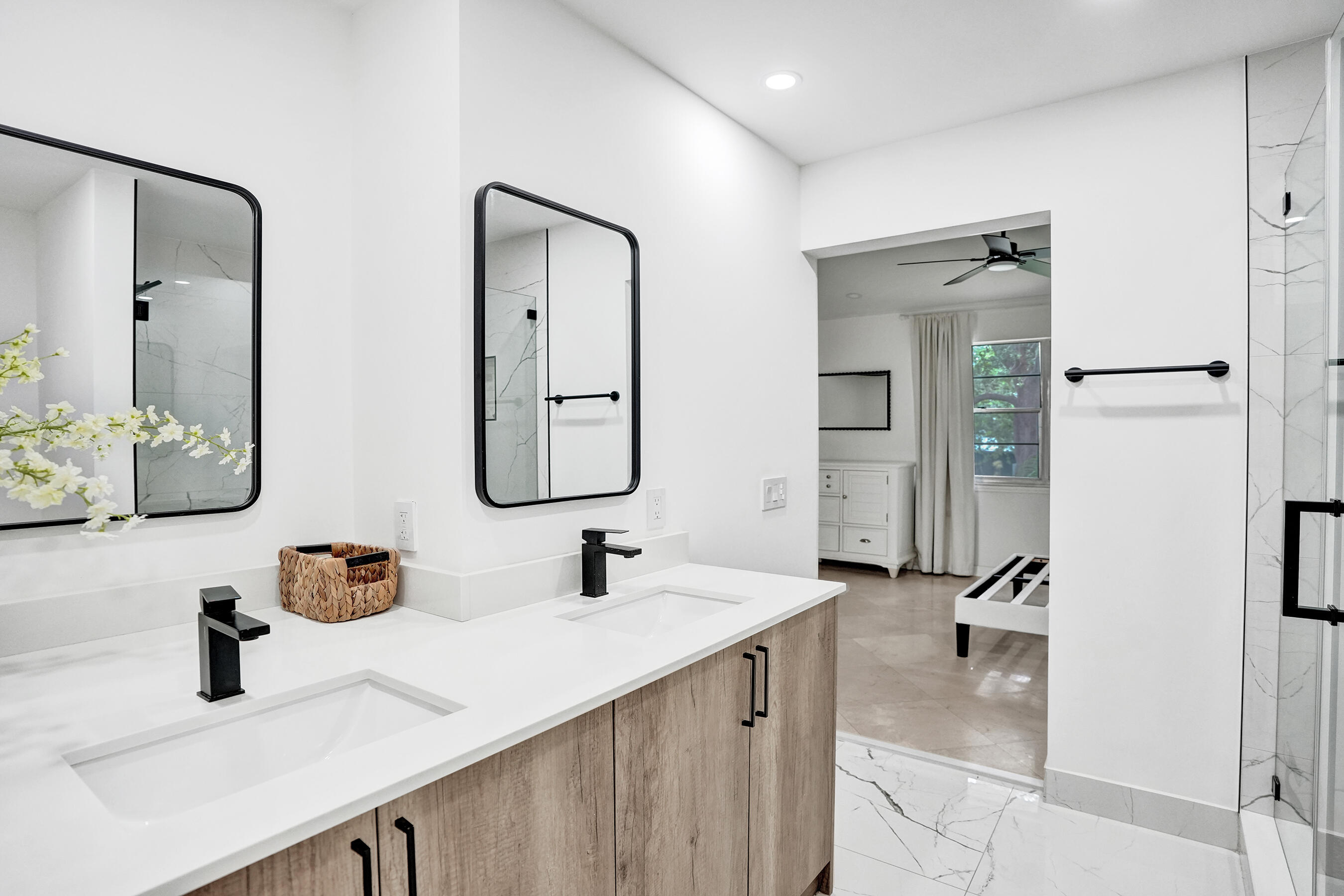 147 Southwest 3rd Street Pompano Beach, FL 33060 - Photo 21 of 29 a bathroom with a double vanity sink and a mirror
