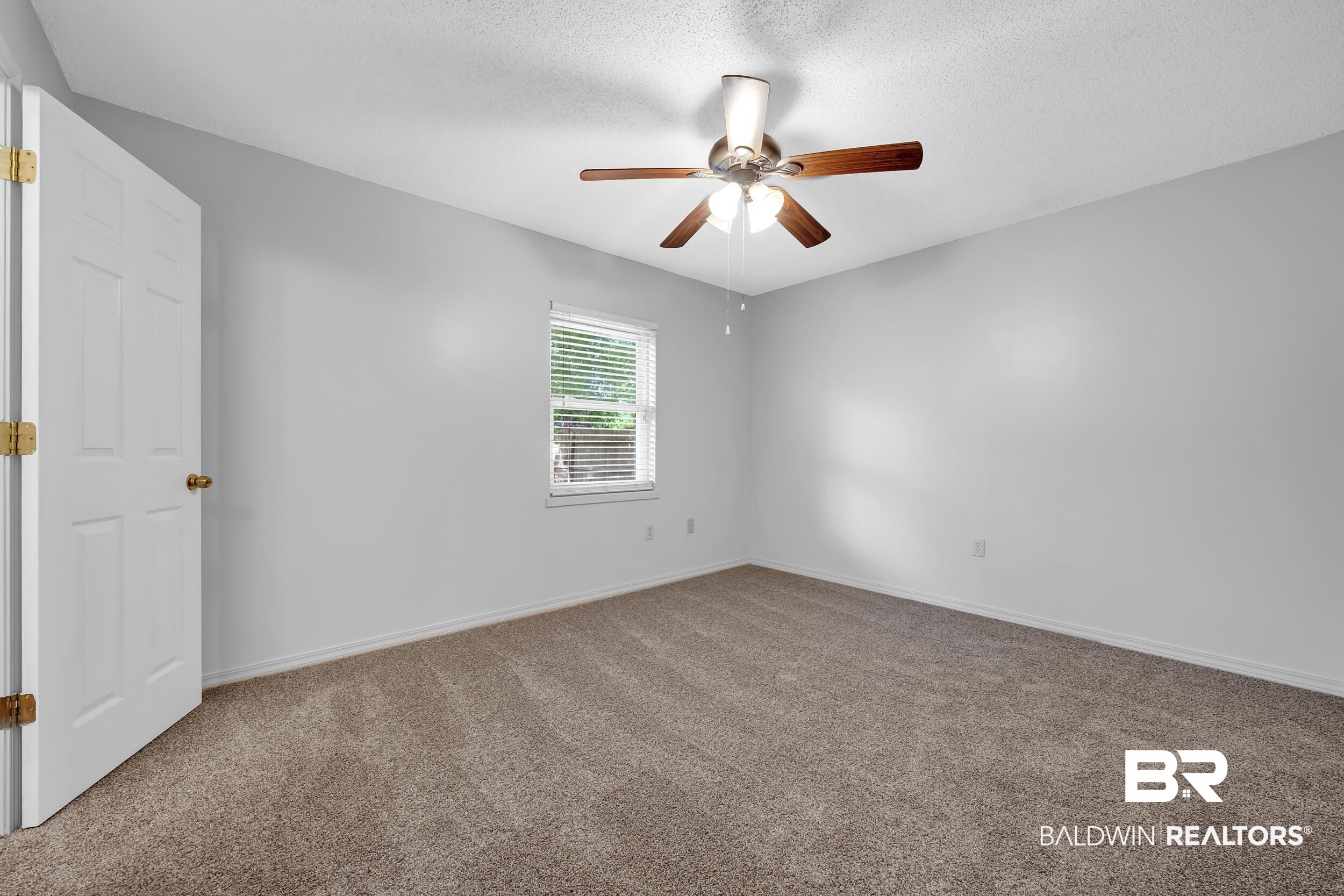 421 Cedar Court Foley, AL 36535 - Photo 29 of 39 Carpeted interior space featuring light gray walls and a textured white ceiling
