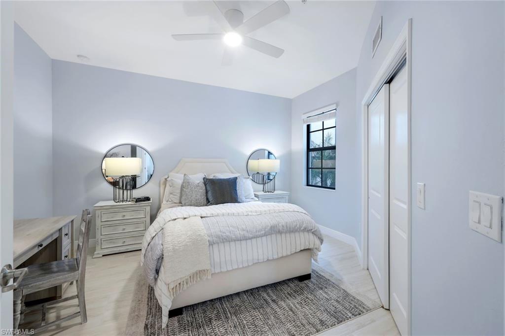 16348 Viansa Way, Unit 101 Naples, FL 34110 - Photo 15 of 34 a bedroom with a bed and window