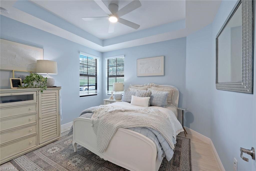 16348 Viansa Way, Unit 101 Naples, FL 34110 - Photo 17 of 34 a bedroom with a bed and a window