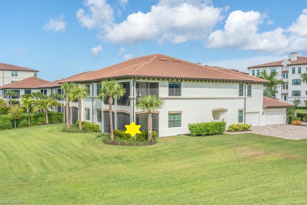 16348 Viansa Way, Unit 101 Naples, FL 34110 - Photo 26 of 34 a front view of house with yard and green space