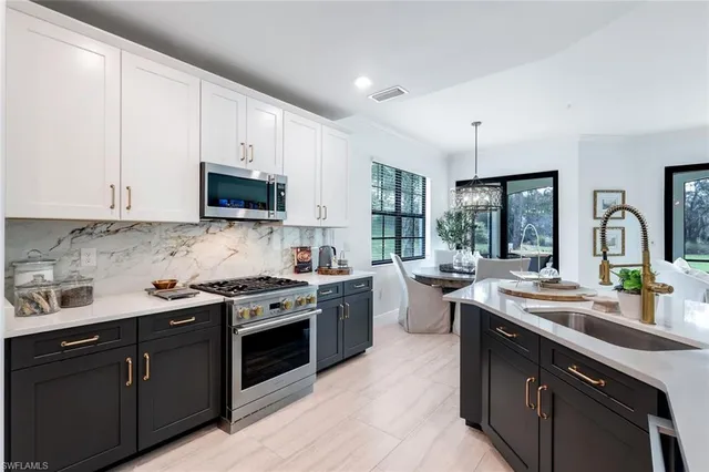 a kitchen with a sink stove and cabinets
