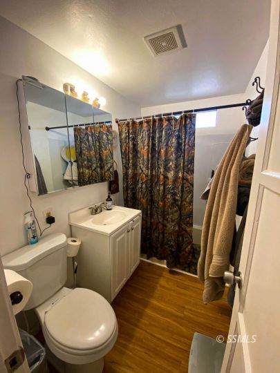 333 North Helena Street Ridgecrest, CA 93555 - Photo 21 of 35 a bathroom with a toilet sink and shower