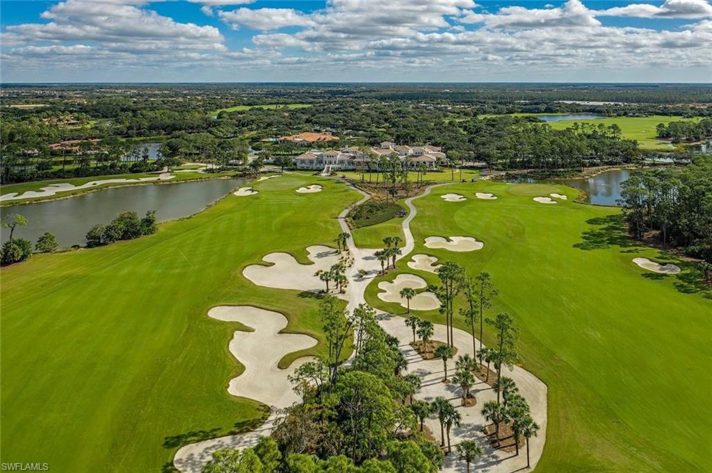 16755 Lucarno Way Naples, FL 34110 - Photo 42 of 50 a view of a lake with a mountain