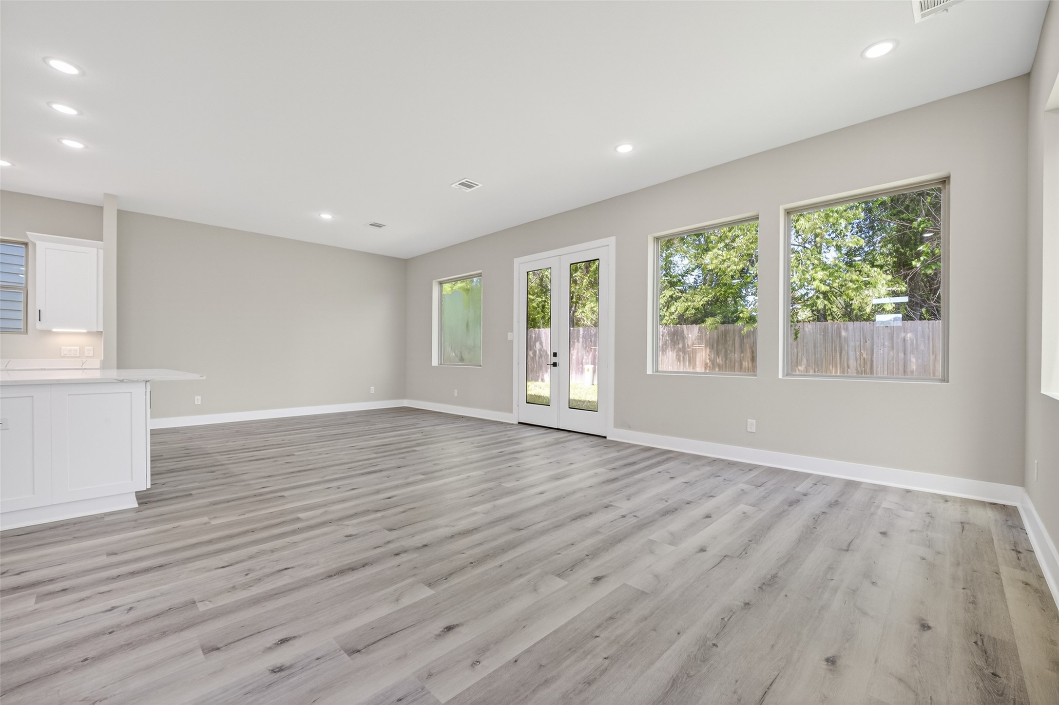 4902 Wunder Way Houston, TX 77069 - Photo 10 of 41 a view of an empty room with wooden floor and a window