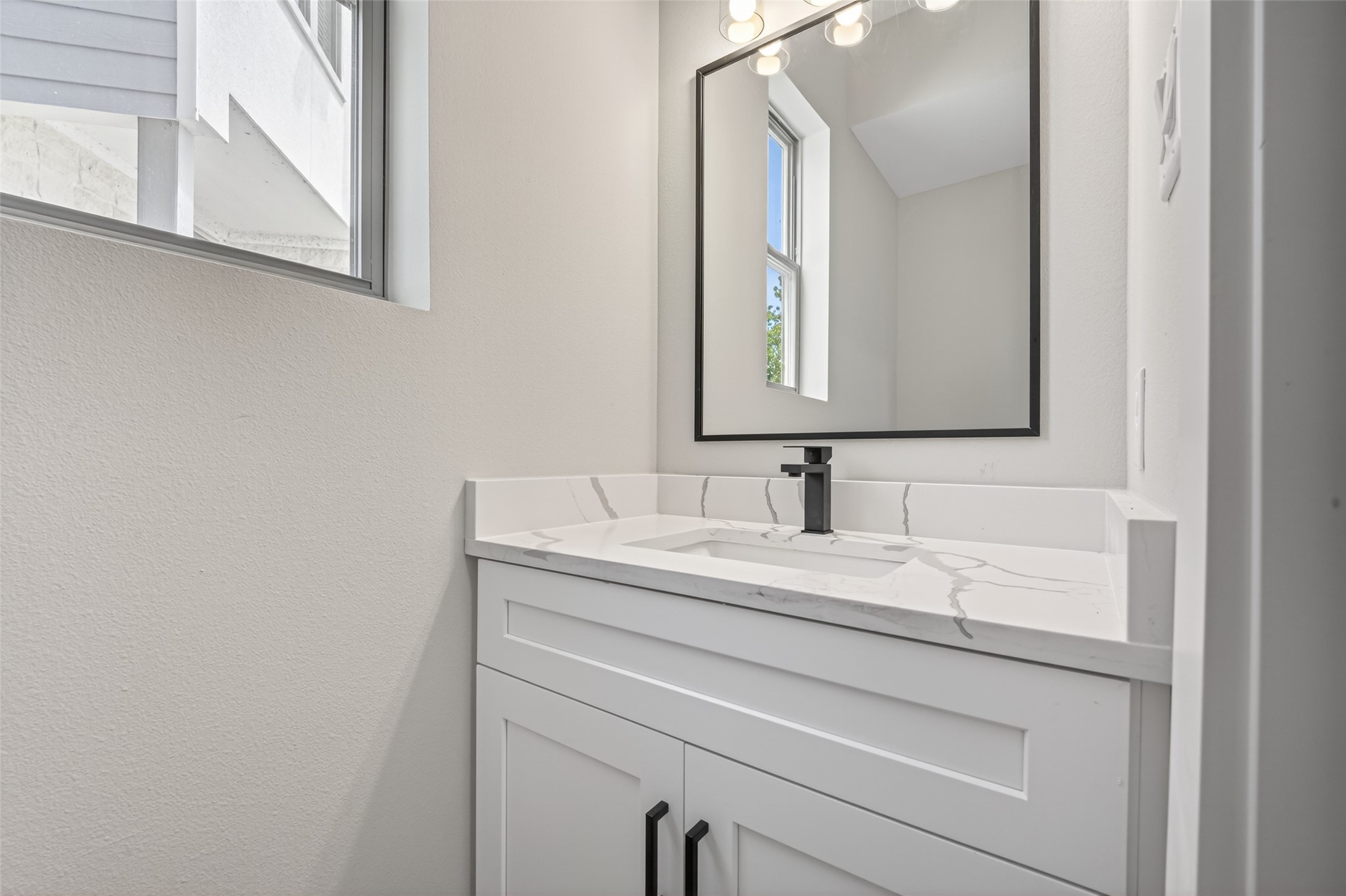 4902 Wunder Way Houston, TX 77069 - Photo 12 of 41 a bathroom with a sink and a mirror