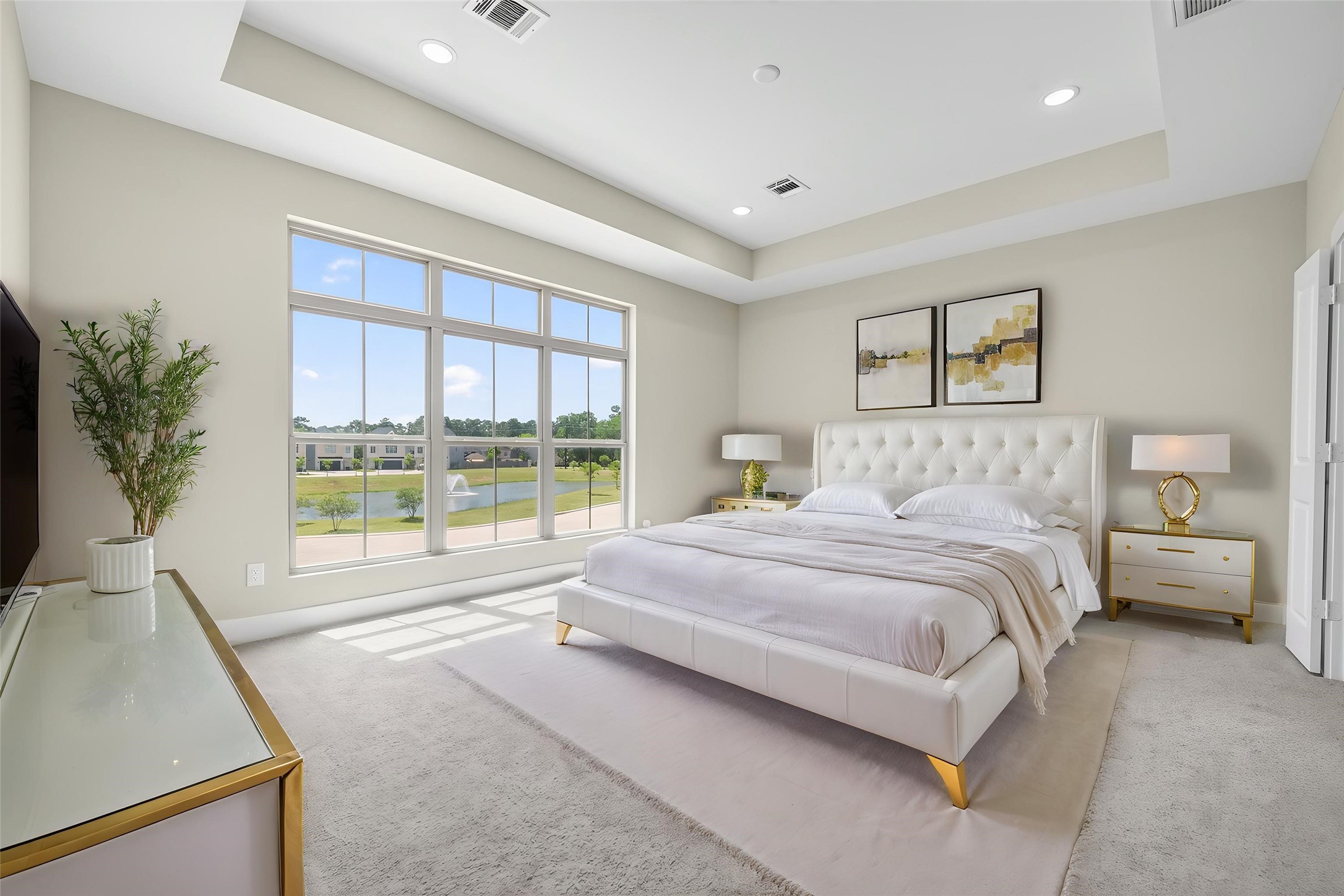 4902 Wunder Way Houston, TX 77069 - Photo 16 of 41 a spacious bedroom with a large bed and a large window