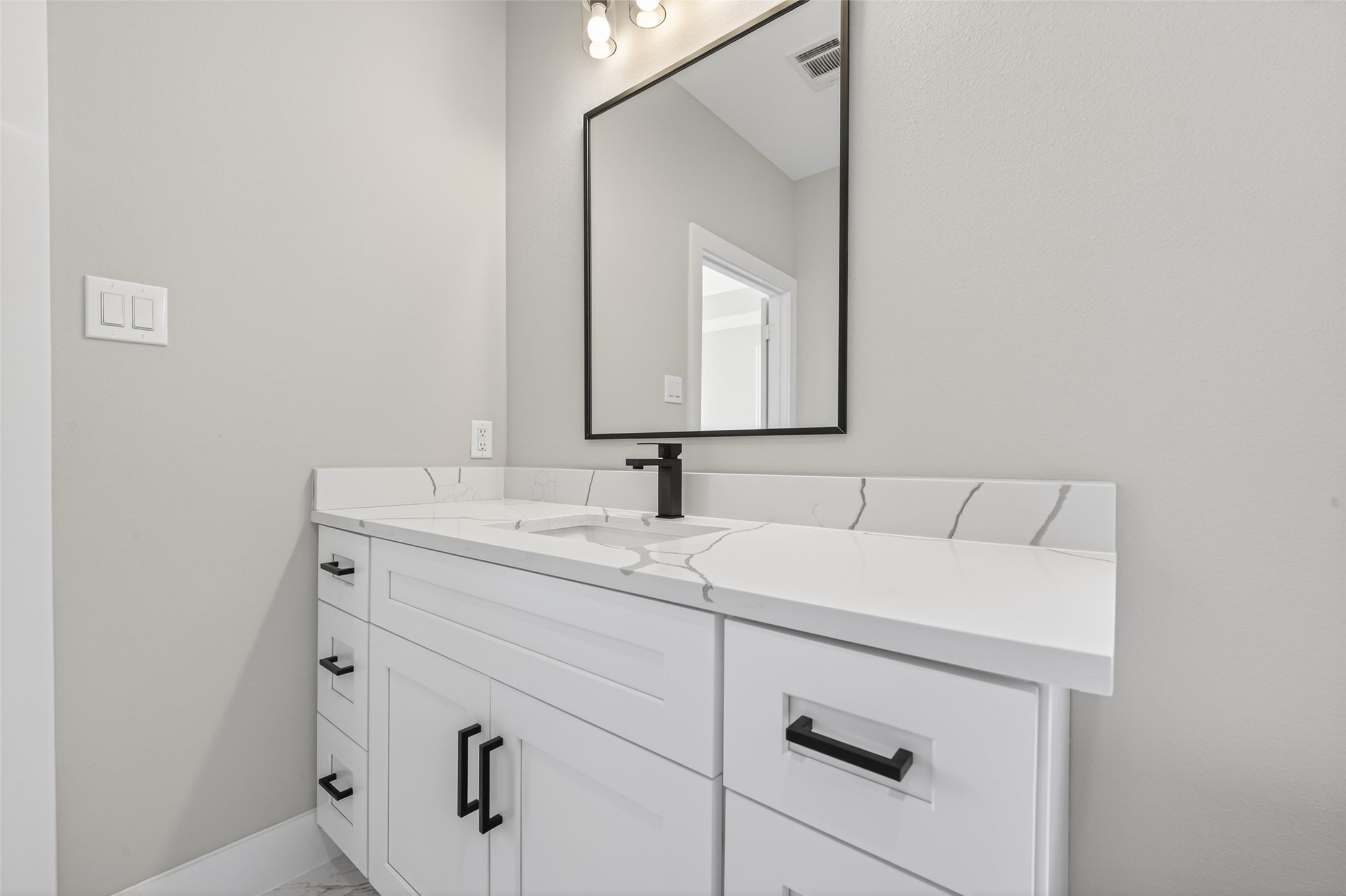 4902 Wunder Way Houston, TX 77069 - Photo 22 of 41 a bathroom with a sink and a mirror