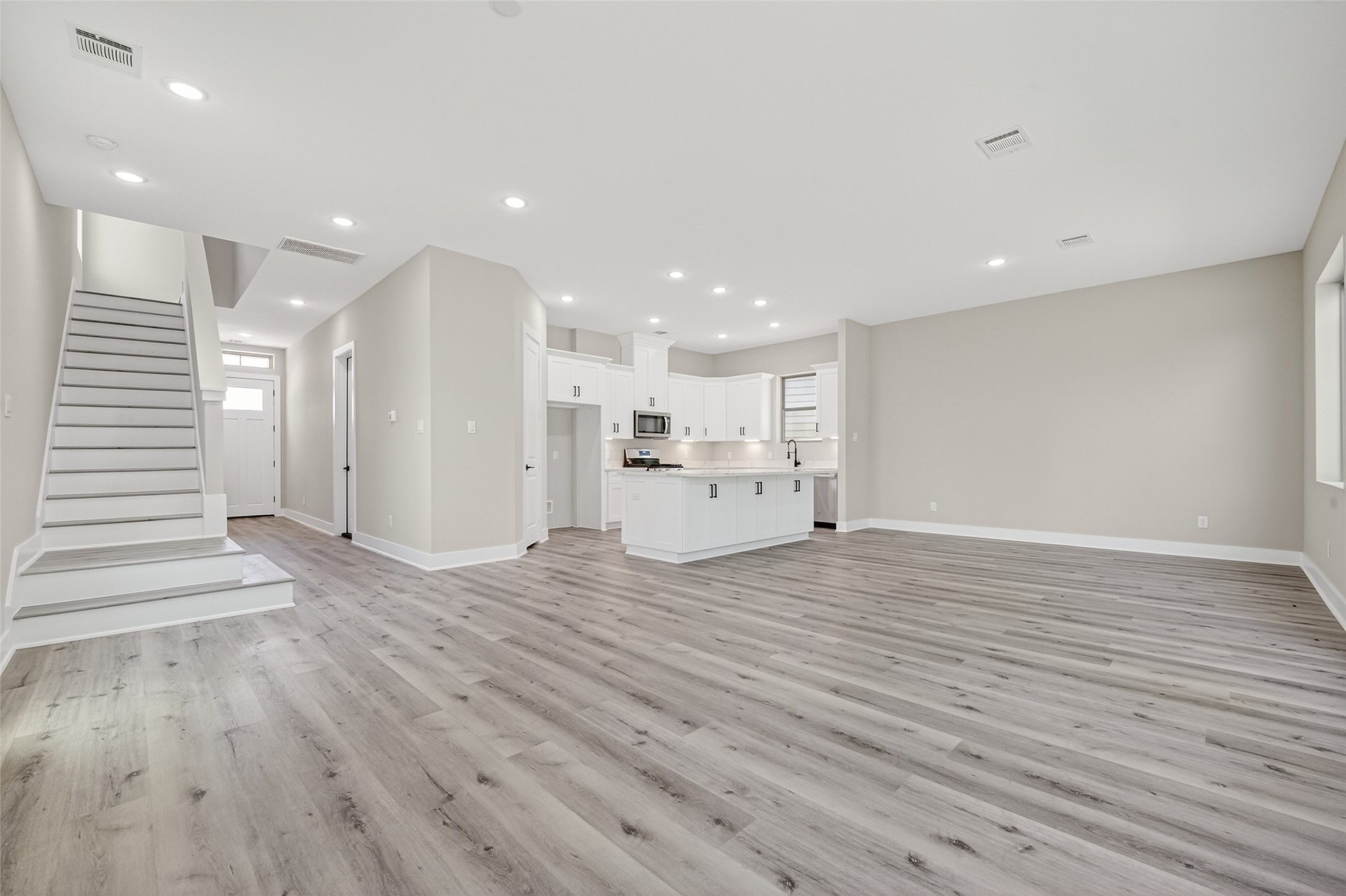 4902 Wunder Way Houston, TX 77069 - Photo 4 of 41 a view of a kitchen with wooden floor and a window