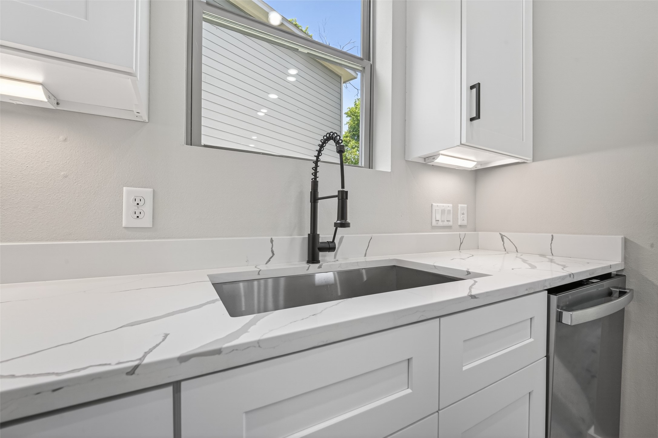 4902 Wunder Way Houston, TX 77069 - Photo 7 of 41 a kitchen with a sink and a cabinets