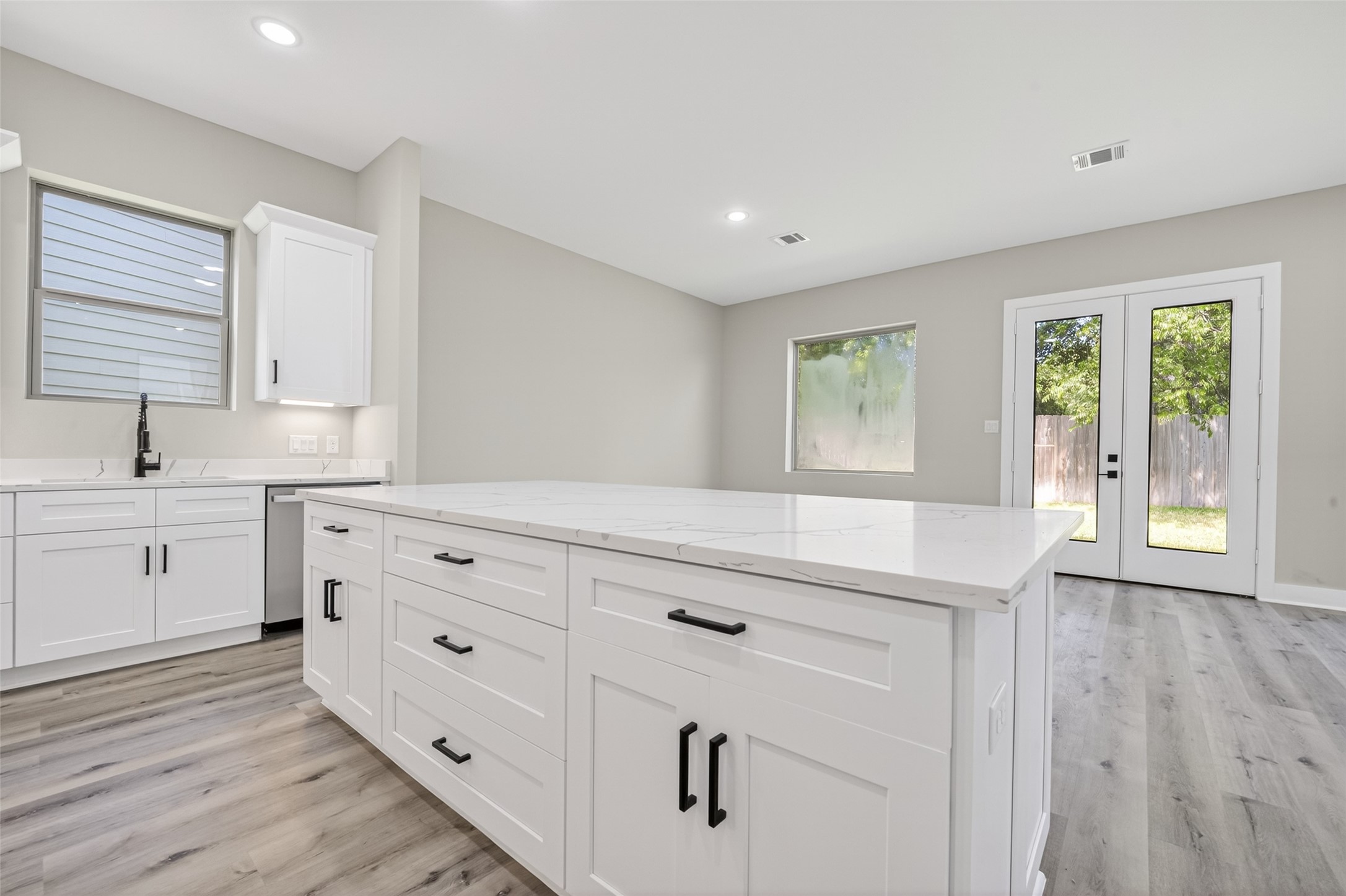 4902 Wunder Way Houston, TX 77069 - Photo 8 of 41 a kitchen with white cabinets and window