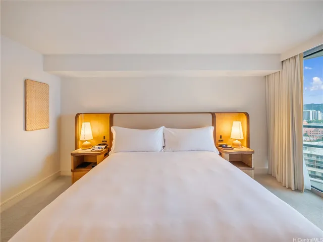 a bedroom with a bed and a tv