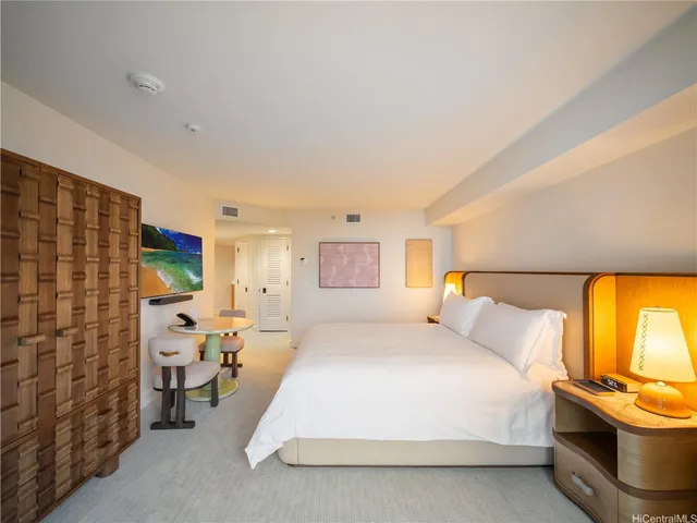 a bedroom with a bed and a couch