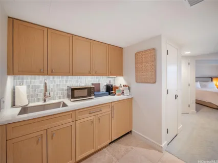 a kitchen with a sink and cabinets