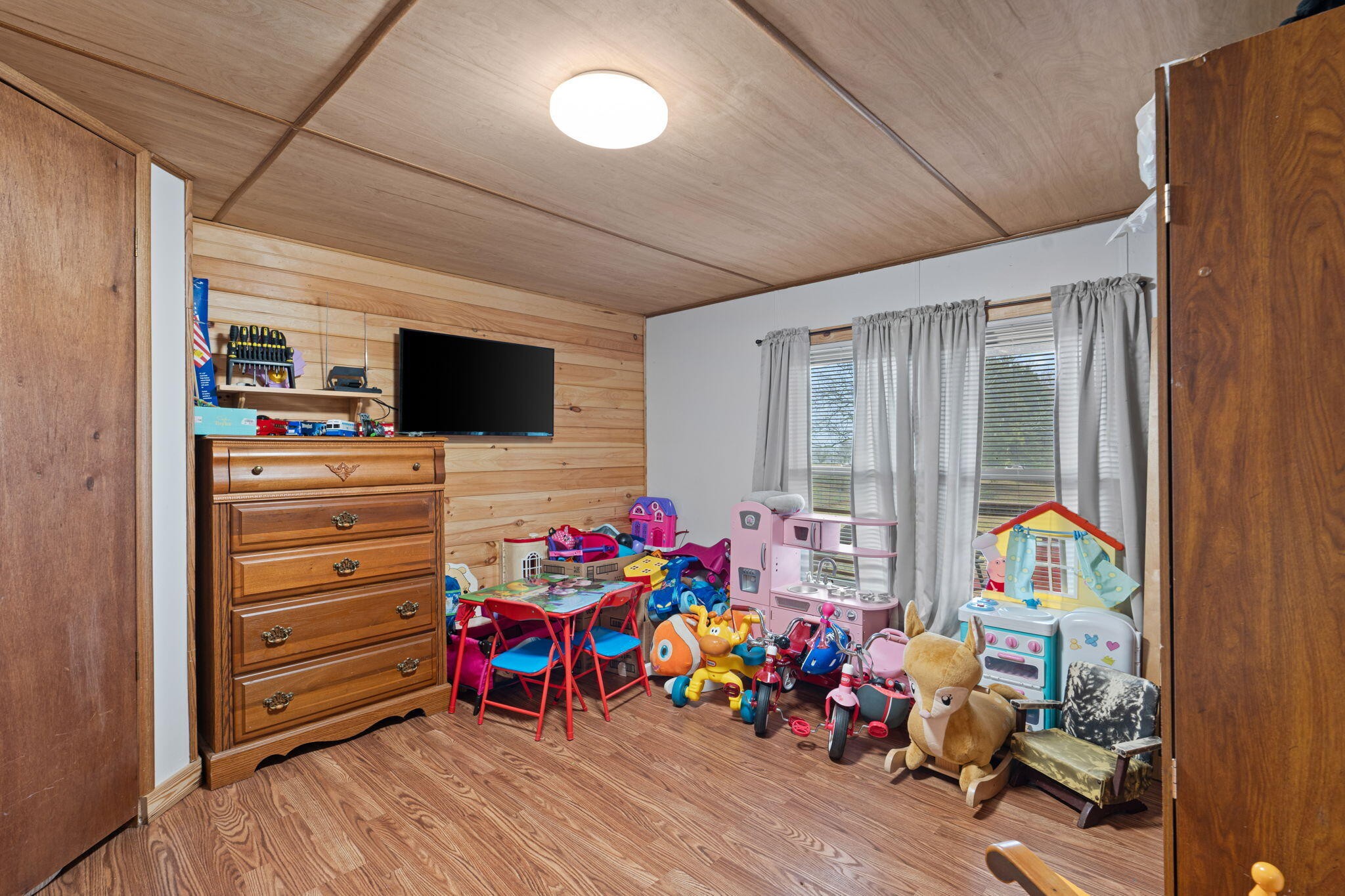 129 Farris Road Cleveland, TN 37323 - Photo 17 of 26 a view of a play room with toys and a flat screen tv