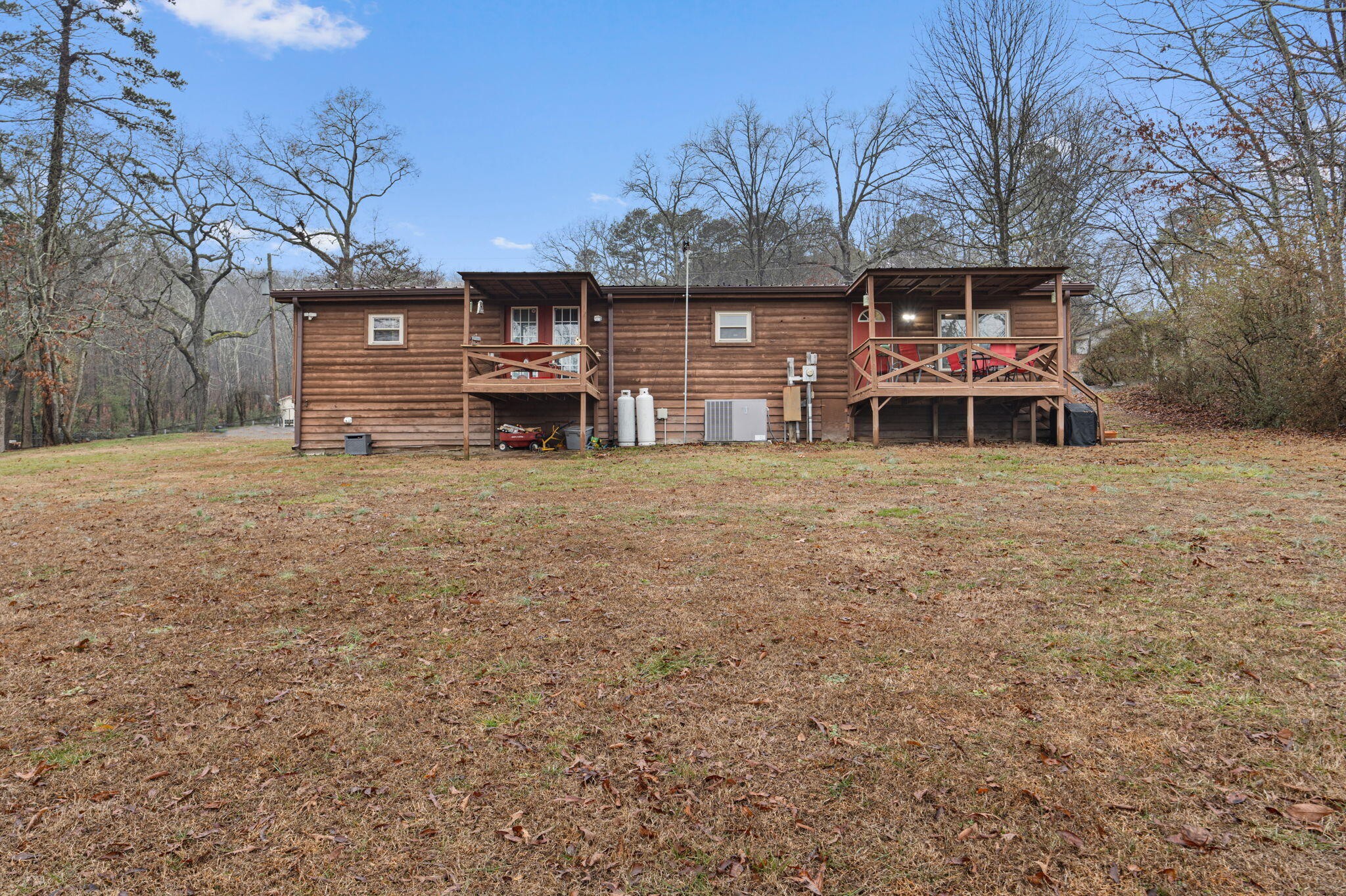 129 Farris Road Cleveland, TN 37323 - Photo 25 of 26 a view of a house with a big yard and large trees