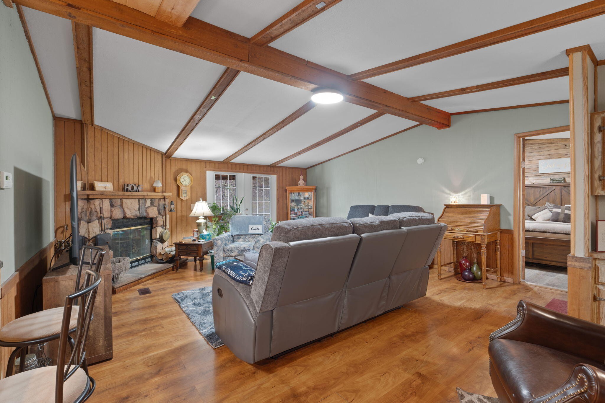 129 Farris Road Cleveland, TN 37323 - Photo 5 of 26 a living room with furniture a fireplace and a flat screen tv