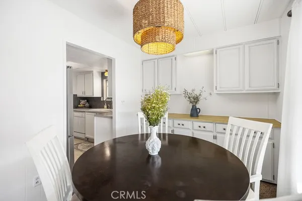 a close view of dining table furniture and chandelier